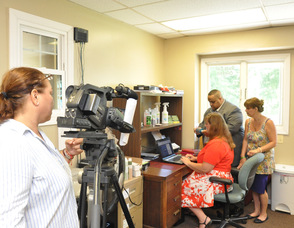 Zaida Collazo, camerawoman, for "Today in America," films Patricia Singer, Ron Gaines, and Rosanne Turkington.