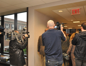 Cameramen follow the Clementi family.