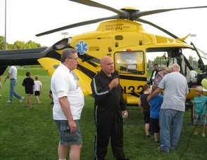 Vernon Mayor Victor Marotta poses in front of the helicopter during a live interview.