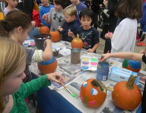 kids painting pumpkins