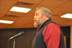 Wayne McCabe speaks at the meeting.