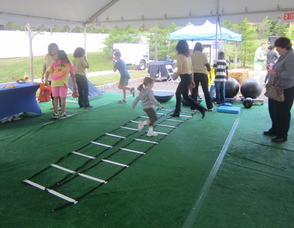 Kids running through exercise drills
