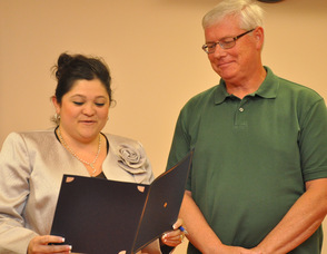 Mayor Helen Le Frois presents Bob Caffrey with a proclamation for his volunteerism to the town.