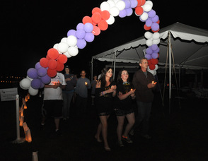 Participants walk under the balloons.