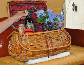 A picnic basket in the back of "Golden Years", filled with a wine commemorating the boat, and flowers grown by Sam Hoagland, the boat's owner, who is also a Master Gardener.