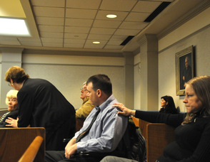Scott Harris' fiancée Kathi Unangst puts a hand on his shoulder.
