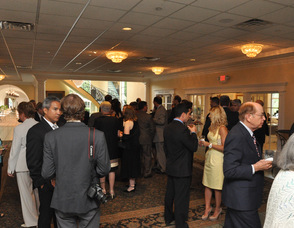 Members of the crowd spend time meeting with the Lieutenant Governor.