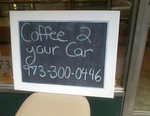 Sign from The Seven Acre Baker alert drivers they could deliver coffee to their cars for them, as they waited for gas.