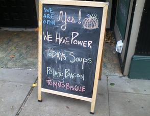 Trinity Restaurant & Lounge on Spring Street advertises it is open for business.
