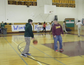 Students playing basketball at the event