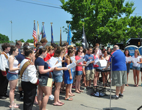 The Newton Madrigals sing "God Bless the USA".