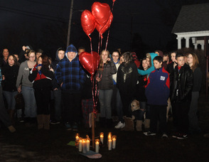 Students hug one another during the vigil.