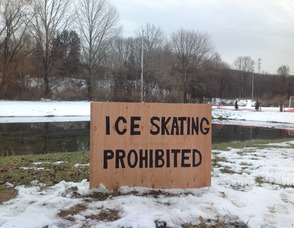 Sign in Newton's Pine Street Park, prohibiting ice skating.