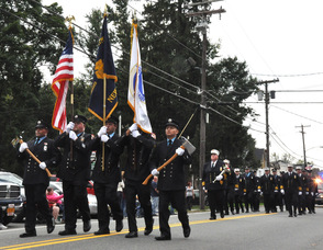 Town of Newton firefighters make their way through town.