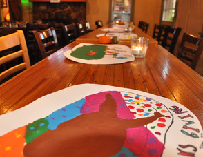 Placemats made by Art Magic, lined the tables.