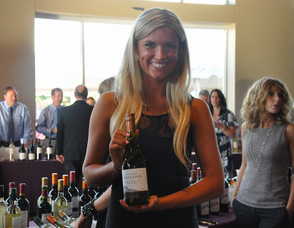 Alicia Mollenkamp holds up a bottle of Molina.