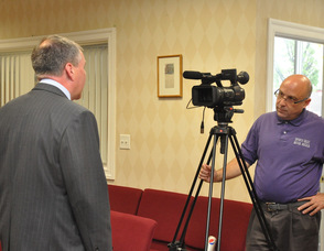 Jerry Morelli of Mugs Media filming Harold Wirths, Commissioner of the State Department of Labor and Workforce Development.