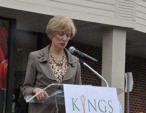President and CEO Judy Spires at the podium.