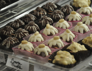Handcrafted Truffles artistically await purchase in the counter.