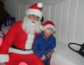 Committee Member Laura Ali Nonnenmacher's  nephew with Santa