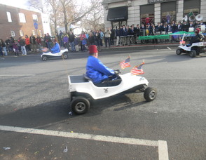 people riding mini cars