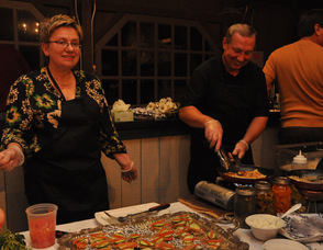Maria and Jack Kaczynski smile as they serve up items on behalf of Bell's Mansion.