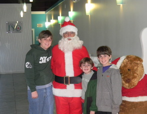 Committee Member Laura Ali Nonnenmacher's   kids with Santa 