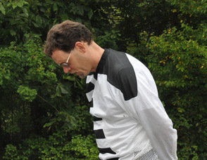 Andy Ball bows his head, as do race participants, for a moment of silence.