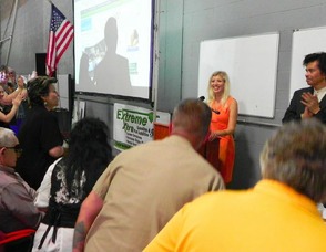 Jennifer Jean Miller receives a standing ovation at the podium.