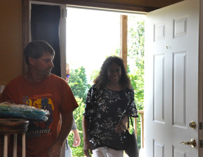 Toni Zimmer smiles as she enters the event.