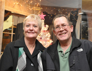 Julie and Bob Simms of Diva Designs in front of their winning window, designed by Toni Sabol.
