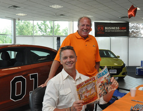 Bill Snouffer and John Schneider smile for the camera.