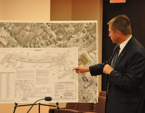 Cory Stoner shows the conceptual drawing for the Railroad Right of Way area.