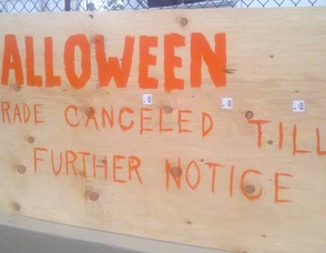 A sign posted yesterday alerting residents the Halloween festivities were cancelled in Newton.