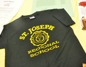 The school's logo on a t-shirt on display.