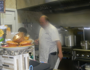 Co-owner Yoram Aflalo cooking at the cafe