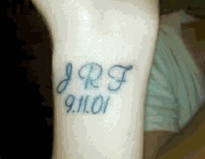 A tattoo on the arm of Maggie Fisher, in memory of her father, John Fisher, who died at the World Trade Center.
