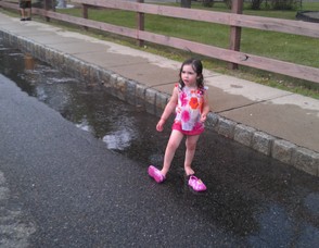 Emma Carrabba, 3, plays barefoot in the water.