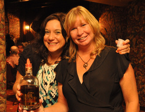 Maria Lake and Shawn Stinett serve up samples of Irish Whiskey, Irish Cream, and French Cognac.