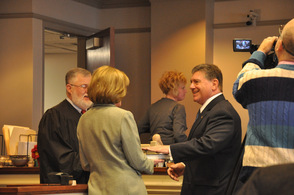Judge Edward V. Gannon swears in Gary Chiusano to Surrogate, as his wife Carol, holds the Bible.