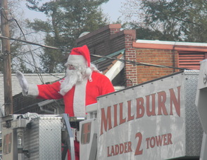 Santa arriving on the firetruck