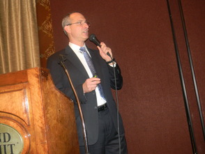 Dr. Robert Brenner speaking at the Suburban Chamber of Commerce Breakfast