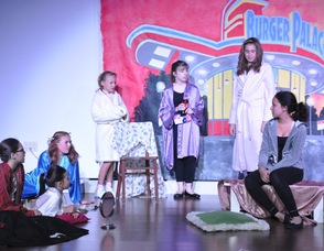 The girls chat during their slumber party.
