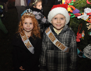 Little Miss Newton Averi Dodd, and Little Mister Newton James Detwiller, in front of the town's Christmas Tree.