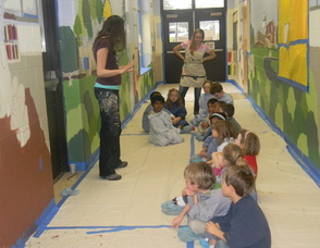 Muralist Caren Frost Olmsted speaking to the students