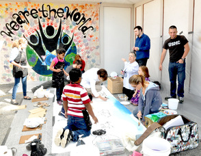 Students from the Birykov Academy, painting the mural.