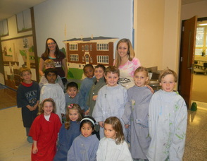 Art Teacher Jaimie Bass with the first grade students