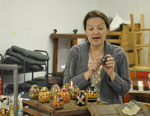 Maggie Tarris Bauer holds up a Pysanky egg.