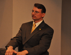 Samuel K. Burlum looks on during the question and answer portion of the session in which he was a guest speaker.