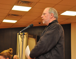 Resident Neil Flaherty inquires about the water ban.